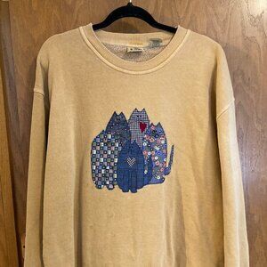 Tan sweatshirt with adorable cat design.